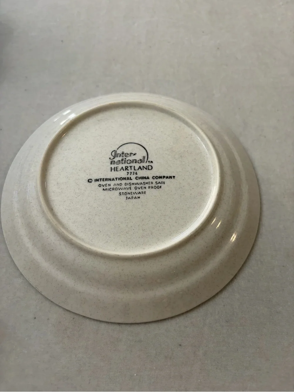 International Cream Ceramic Cup and Saucer Set with Hand-Painted Village Design